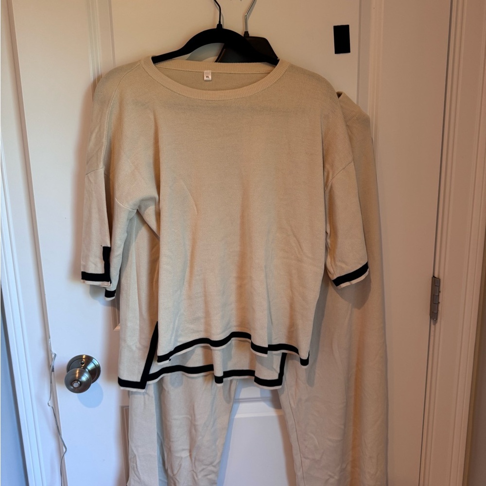 Elegant Cream Sweater and Pants Set with Black Accents